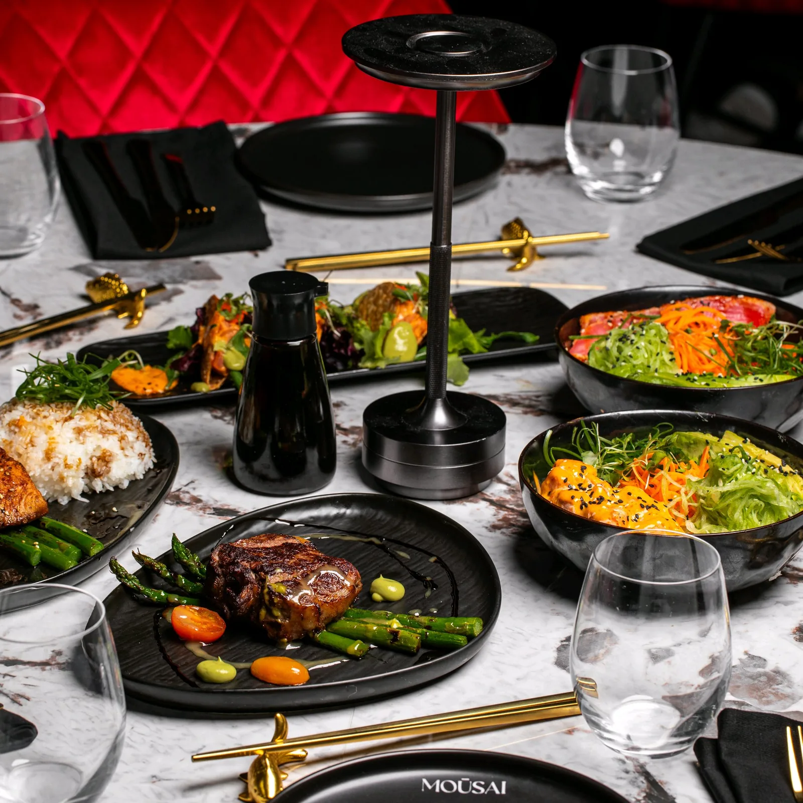 A spread of dishes on the real Mousai dining table