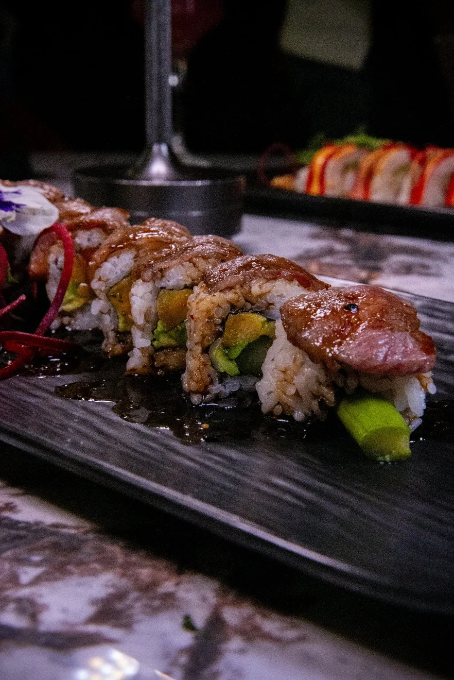 Mousai sushi served on the original black platter
