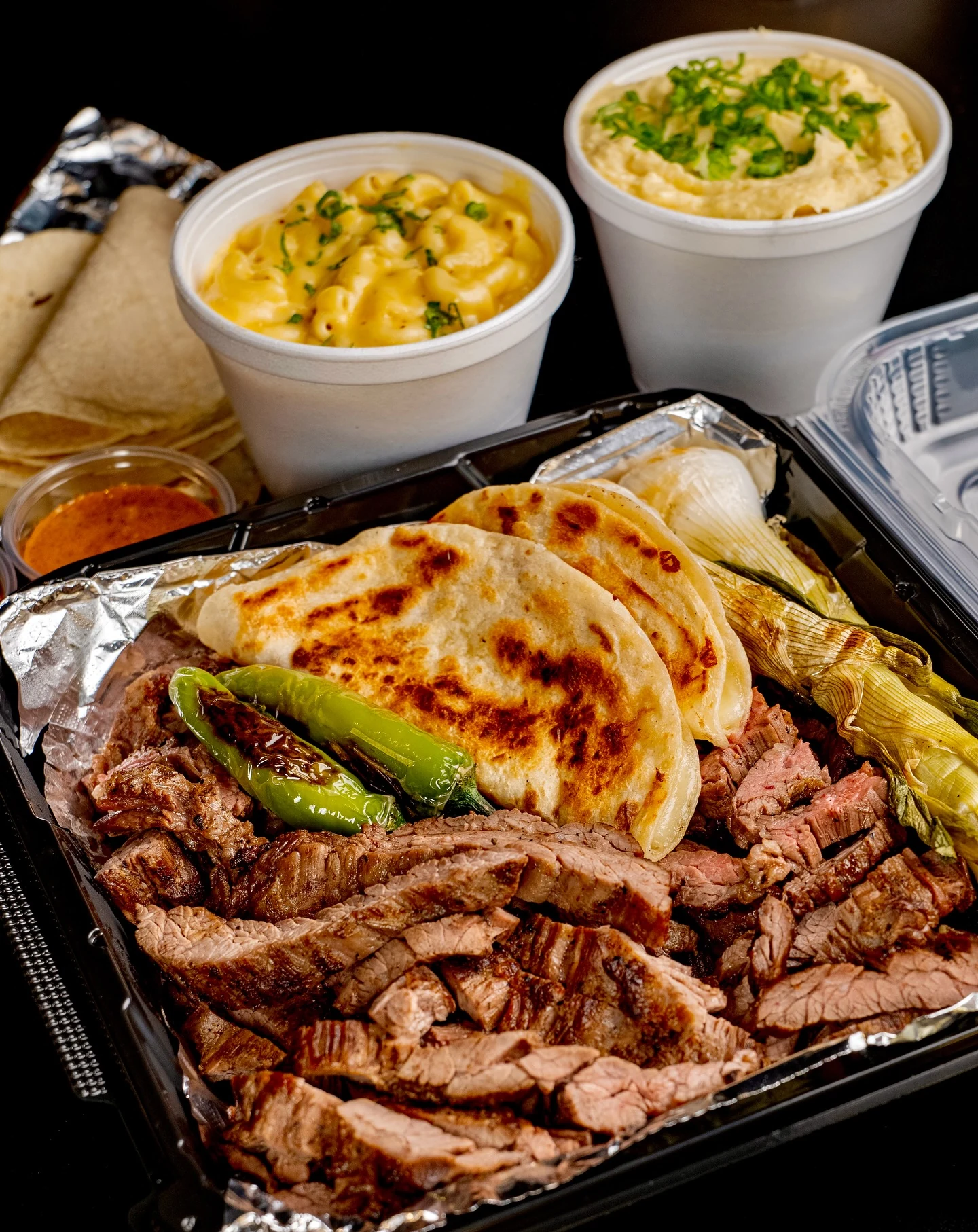 Corte Fino’s fajita platter with grilled peppers, tortillas and sides