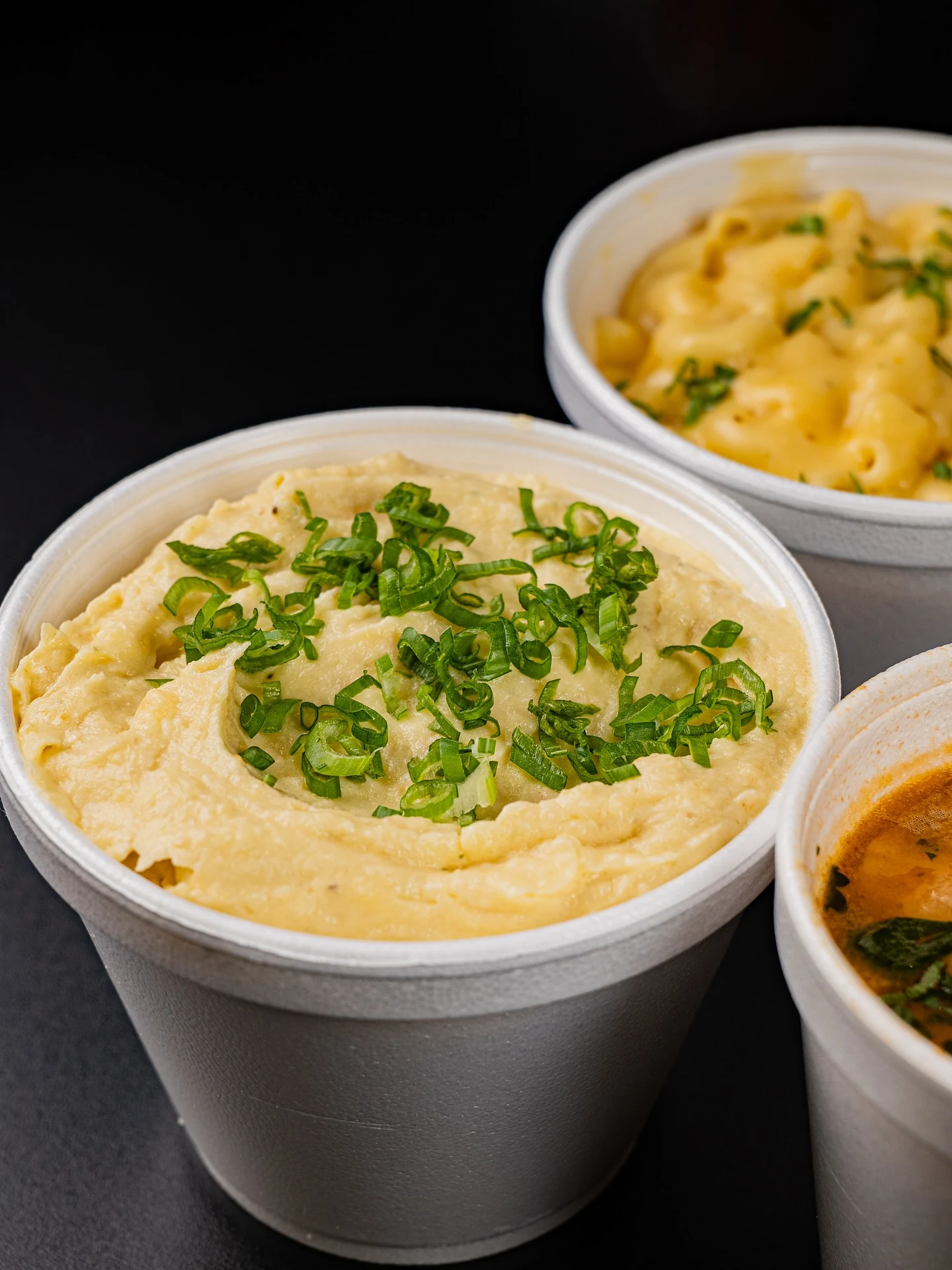 Corte Fino’s mashed potatoes with chopped herbs, mac and cheese and charro beans